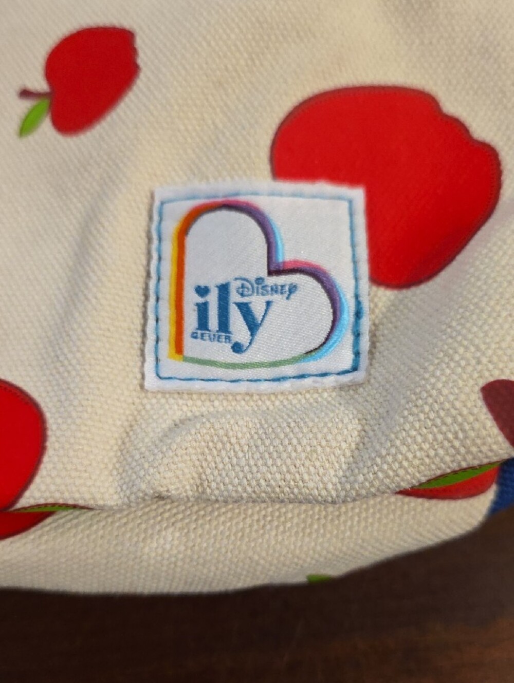 (J51) Disney Cream Backpack with Red Apple Print and Blue Strap - Picture 2 of 6